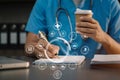 Close-up shot of female medical doctor's hands write a note. Doctor's working place. Healthcare and medical concept