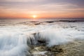 Close up shot of a foamy ocean wave during the golden hour Royalty Free Stock Photo