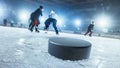 Close-up Shot with Focus on a 3D Hockey Puck on Ice Hockey Rink Arena. In the Background Blurred Royalty Free Stock Photo