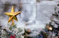 Close-up shot focus on yellow star from a decorated Christmas tree. Retro filter effect. Christmas tree and Christmas decorations Royalty Free Stock Photo