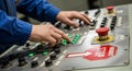 Operator\'s Hands Adjusting Controls on Industrial Machine Panel control panel Royalty Free Stock Photo