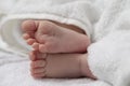 Close-up Shot of a  Four Week Old Baby Boy Crossed Feet Over White Towel Royalty Free Stock Photo