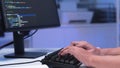 Close-up shot of IT freelancer's hand typing software code for application. Royalty Free Stock Photo