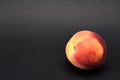 Close up shot of fresh peach on a black background Royalty Free Stock Photo