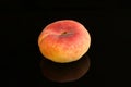 Close up shot of a fresh peach isolated on a black background Royalty Free Stock Photo