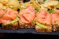 Smoked Salmon with Guacamole on Brown Bread. Royalty Free Stock Photo