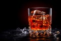 Close-up shot of a freshly poured Sazerac cocktail. Dark background.