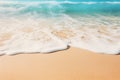 A close-up shot of gentle waves caressing the shore on a pristine sandy beach Royalty Free Stock Photo