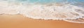 A close-up shot of gentle waves caressing the shore on a pristine sandy beach Royalty Free Stock Photo