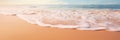 A close-up shot of gentle waves caressing the shore on a pristine sandy beach Royalty Free Stock Photo