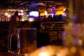 Close up shot of glass of beer on a blurry pub background. Selective focus Royalty Free Stock Photo