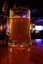 Close up shot of glass of beer on a blurry pub background. Selective focus Royalty Free Stock Photo