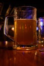 Close up shot of glass of beer on a blurry pub background. Selective focus Royalty Free Stock Photo