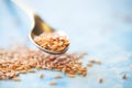 close-up shot of golden flaxseeds on a spoon