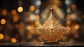 close-up shot of a golden star tree topper, positioned at the peak of a Christmas tree Royalty Free Stock Photo