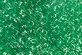 Decorative background from green glass with multiple cracks