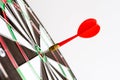 Close up shot green and red darts arrows in the target center. Royalty Free Stock Photo