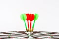 Close up shot green and red darts arrows in the target center. Royalty Free Stock Photo