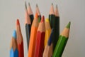 Close-up shot of a group of colored pencils on the white background