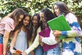 Close-up shot of a group of Latina teenage students taking a selfie with a cell phone Royalty Free Stock Photo
