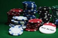 Close up shot of group poker chips on green table Royalty Free Stock Photo