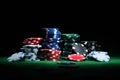 Close up shot of group poker chips on green table