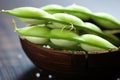 close up shot of half opened edamame pod