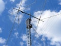 A close-up shot of a ham radio antenna against a cloudy sky Royalty Free Stock Photo