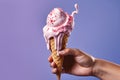 A close - up shot of a hand holding a melting ice cream cone, capturing the anticipation and enjoyment as the creamy treat slowly Royalty Free Stock Photo