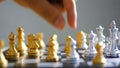 Close up shot hand of man and woman play gold and silver chess metaphor business compettition concept select focus shallow depth o