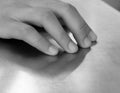 CLOSE-UP SHOT OF HAND ON STEEL TABLE