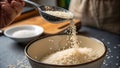 Pouring Perfection: Cooked Rice from Spoon to Bowl Royalty Free Stock Photo
