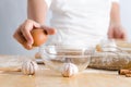 Close up shot hand of woman holding egg for braking shell with g