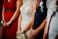 Close up shot of hands of bride, groom, bridesmaid, maid in honor Royalty Free Stock Photo