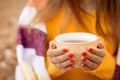 Young girl drinking warm tea in cool autumn weather Royalty Free Stock Photo