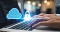 Hands typing on a laptop with glowing cloud and lock icons representing secure cloud computing and data protection Royalty Free Stock Photo