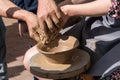 Close up shot of hands making clay bowl during pottery lessons Royalty Free Stock Photo