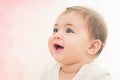 Close up shot of happy smiling baby girl with blue eyes. Soft focus. Royalty Free Stock Photo