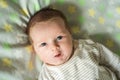 Close up shot of happy smiling baby girl with blue eyes. Soft focus. Royalty Free Stock Photo