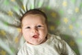 Close up shot of happy smiling baby girl with blue eyes. Soft focus. Royalty Free Stock Photo