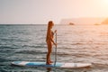 Woman sea sup. Close up portrait of happy young caucasian woman with long hair looking at camera and smiling. Cute woman Royalty Free Stock Photo