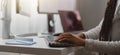 Close up shot of happy young woman working on computer, female hands typing on keyboard Royalty Free Stock Photo