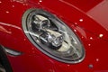 Close up shot of headlight in luxury red car Royalty Free Stock Photo