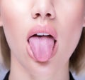 Close up shot of an open mouth and a healthy human tongue Royalty Free Stock Photo