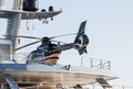 Close-up shot of a helicopter on a yacht at the port of Olbia in Italy