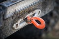 Hook of a winch on a dirty off road vehicle