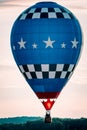 Close up shot of hot air balloon at an air show landing at sunset Royalty Free Stock Photo