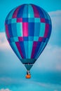 Close up shot of hot air balloon flying by at sunset