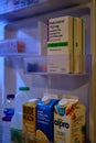 close up shot of a household fridge with tocilizumab injections stored inside