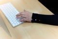 Close up shot of human woman hands using laptop computer, typing, writing, taking note Royalty Free Stock Photo